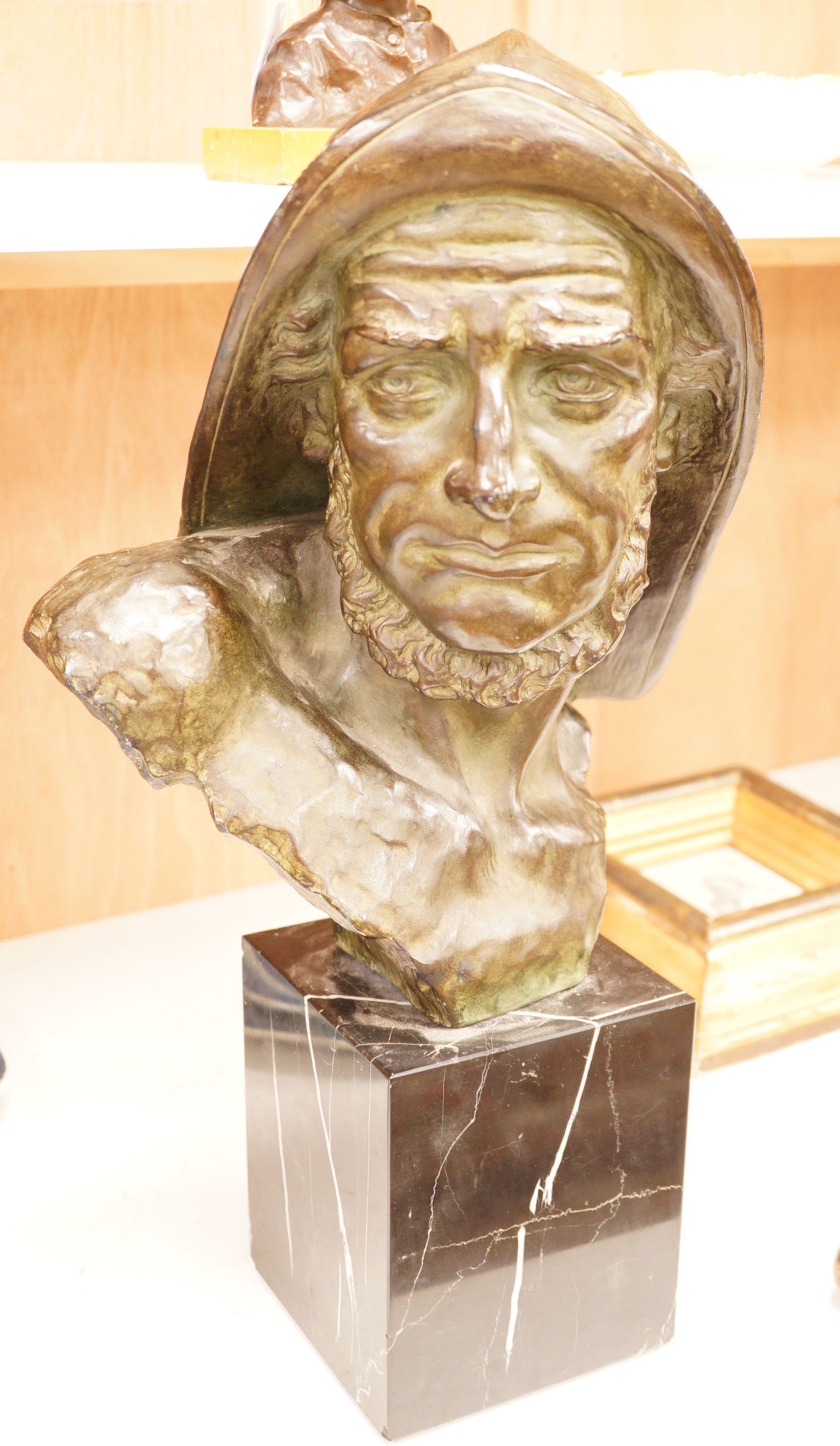 Johannes Dommisse (1878-1955) A cold painted terracotta bust of a fisherman on plinth base, 53cm tall